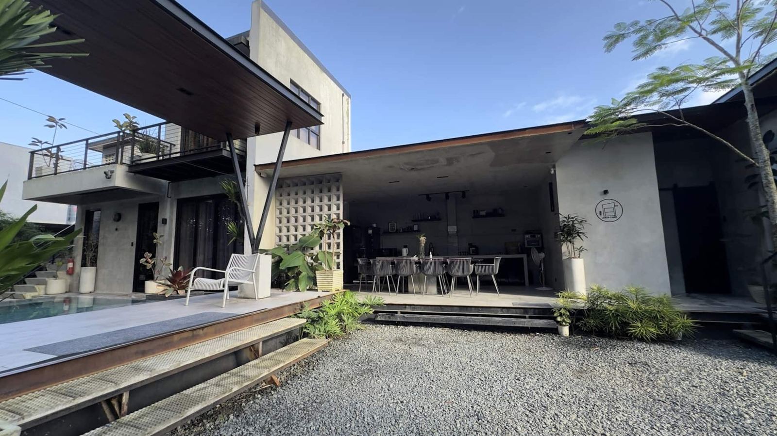 The villa’s pool deck, garden and open living area
