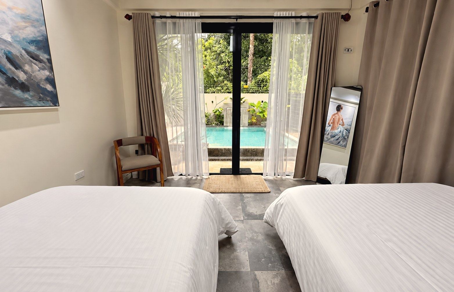 Bedroom with a glass door to the pool