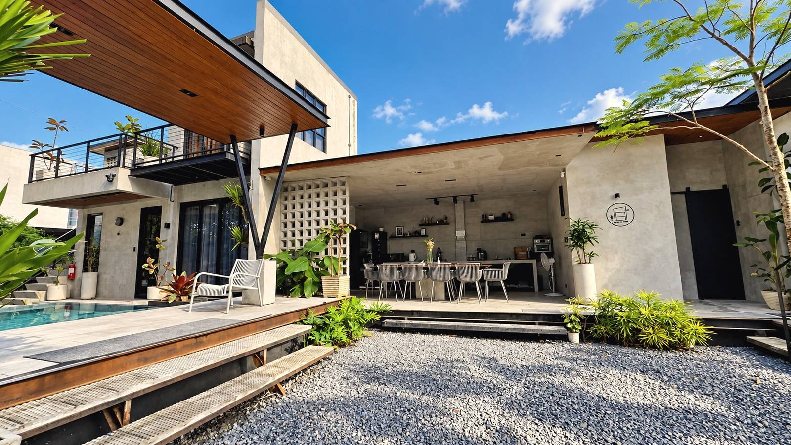 The villa’s pool deck, garden and open living area