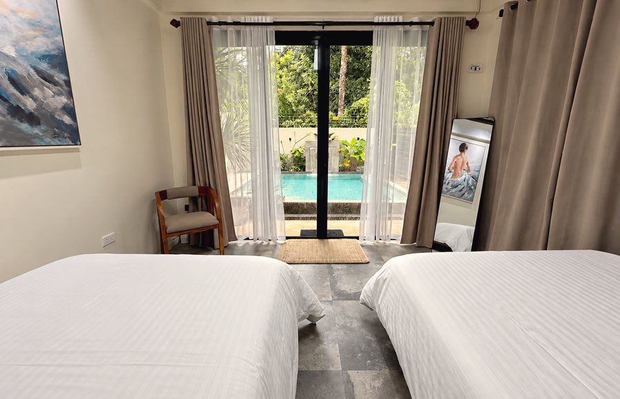 Bedroom 2 glass door facing the pool